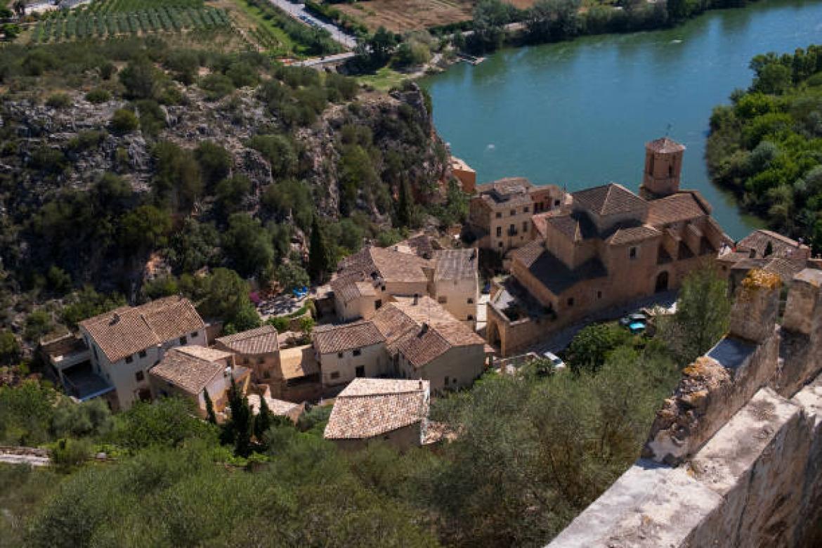 MIRAVET, SPAIN - MAY 3:  A view of the castle of Templar origin, the church, the medieval town on the banks of the Ebro river, on  May 3, 2024 in Miravet, Cataluña, Spain. (Photo by Xurxo Lobato/Getty Images)
