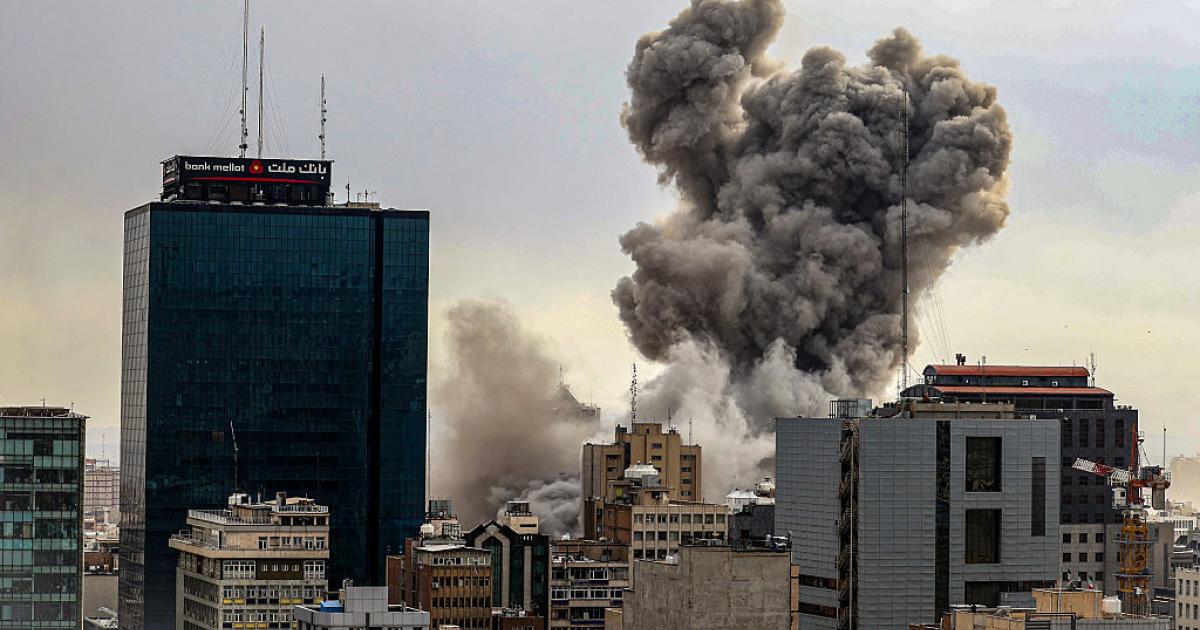 TEHRAN, IRAN - MARCH 02: A general view of Tehran with smoke visible in the distance after explosions were reported in the city, on March 02, 2026 in Tehran, Iran. (Photo by Contributor/Getty Images)