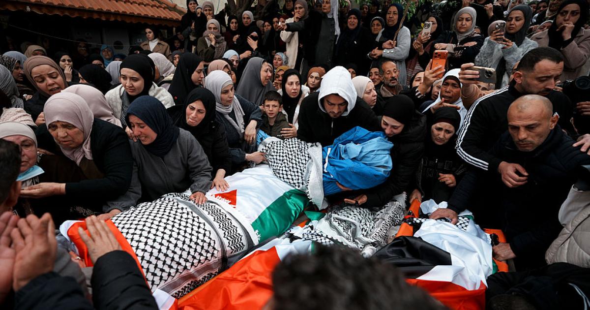 TUBAS, WEST BANK - MARCH 15: People attend the funeral ceremony of Palestinian mother, father, and two children who lost their life as a result of Israeli forces' opening fire at the village of Tamun, near the city of Tubas, West Bank on March 15, 2026. (Photo by Issam Rimawi/Anadolu via Getty Images)