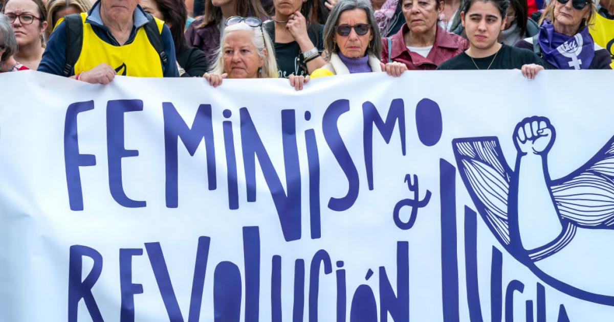 Protesters hold a banner saying ''feminism, revolution and struggle'' during the International Women's Day demonstration in Santander, Spain. (Photo by Celestino Arce/NurPhoto via Getty Images)