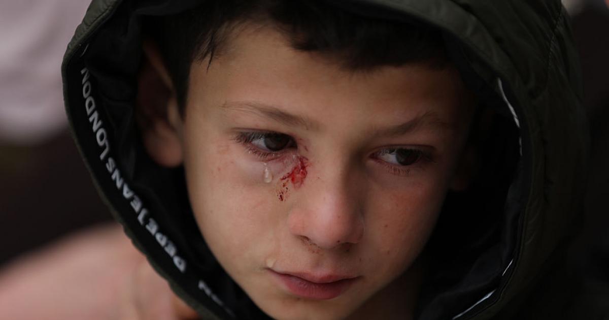 15 March 2026, Palestinian Territories, Tammun: A child bids farewell to Ali Khaled Bani Odeh, 37, his wife Waad Othman Bani Odeh, 35, and their two children, 5-year-old Mohammad and 7-year-old Othman, who were killed by Israeli occupation forces during a raid on the town of Tammun, south of Tubas, in the northern West Bank. Photo: Ayman Nobani/dpa (Photo by Ayman Nobani/picture alliance via Getty Images)