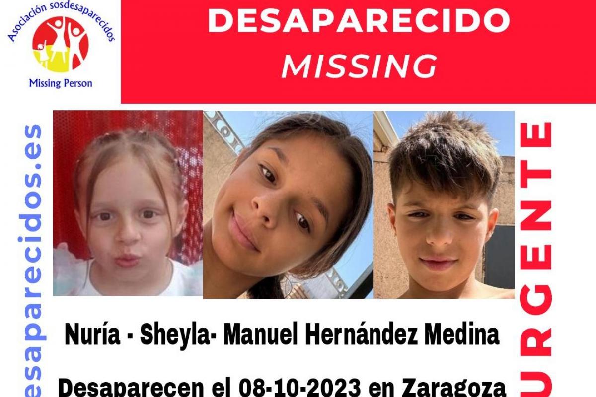 Cartel con los tres menores desaparecidos a los que se busca.