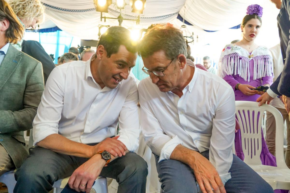 Moreno Bonilla y Núñez Feijóo charlan en un reciente acto