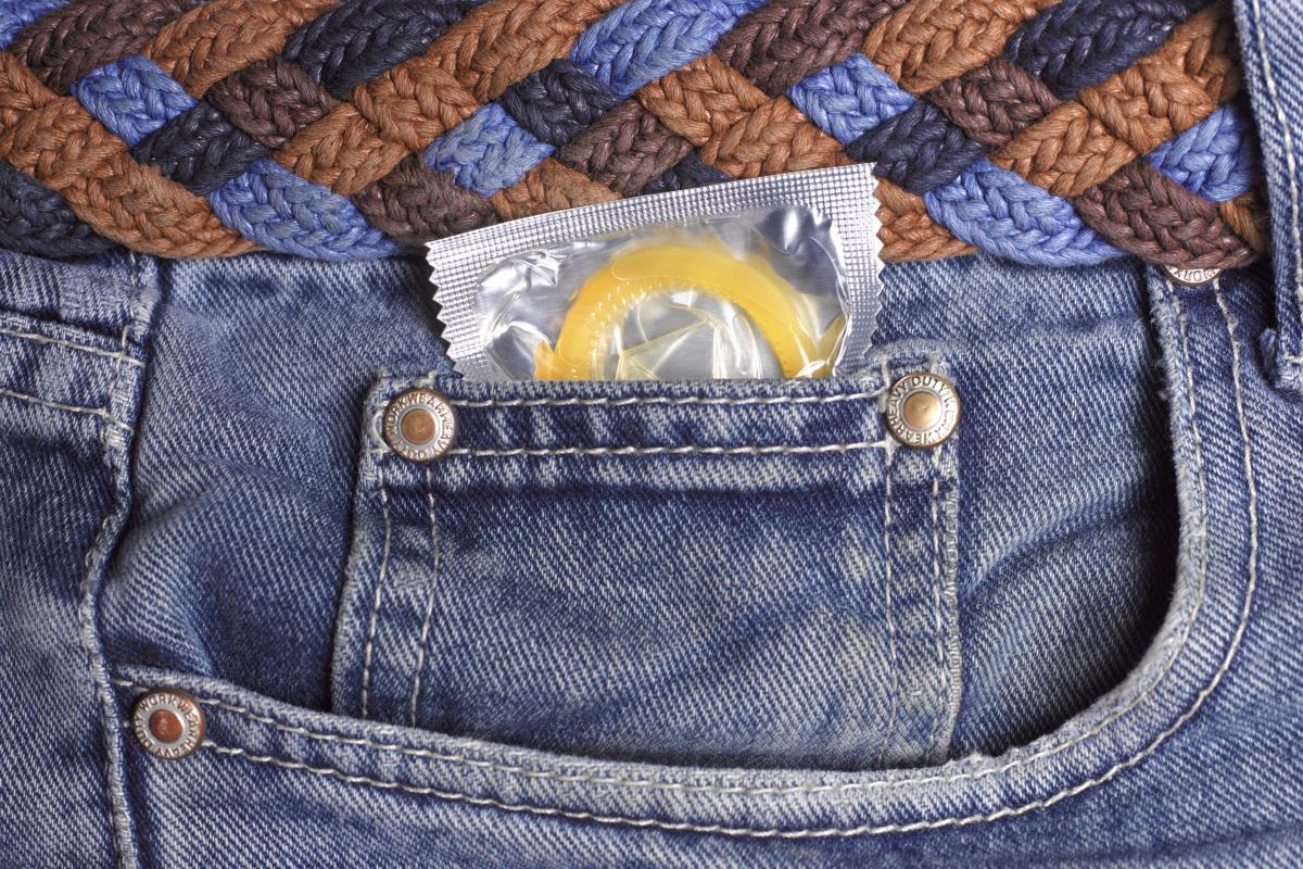 Condom in jeans pocket close up