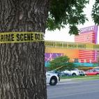 Police cars in front of the Century 16 theater in Aurora, Colorado where a gunman opened fire during the opening of the new Batman movie "The Dark Knight Rises" killing at least 15 people and wounding 50 others on the morning of July 20, 2012. ...