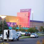 Police cars in front of the Century 16 theater in Aurora, Colorado where a gunman opened fire during the opening of the new Batman movie "The Dark Knight Rises" killing at least 15 people and wounding 50 others on the morning of July 20, 2012. ...