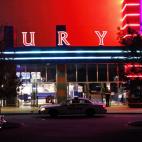 Police are pictured outside of a Century 16 movie theatre where as many as 12 people were killed and many injured at a shooting during the showing of a movie at the in Aurora, Colo., Friday, July 20, 2012. (Photo credit: AP Photo/Ed Andrieski)