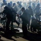 Demonstrators and riot policemen fight during a protest on a day of mobilisation against austerity measures by workers in southern Europe on November 14, 2012 in Rome. Riot police and anti-austerity protesters clashed in Italy on Wednesday as an...