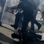 Demonstrators and riot policemen fight during a protest on a day of mobilisation against austerity measures by workers in southern Europe on November 14, 2012 in Rome. Riot police and anti-austerity protesters clashed in Italy on Wednesday as an...