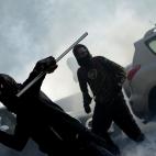 Demonstrators throw projectiles to riot policemen during a protest on a day of mobilisation against austerity measures by workers in southern Europe on November 14, 2012 in Rome. Riot police and anti-austerity protesters clashed in Italy on Wedn...