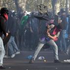 Demonstrators clash with riot police during a protest against Italian Government austerity measures in Rome, Wednesday, Nov. 14, 2012. Workers across the European Union sought to present a united front against rampant unemployment and government...
