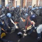 Police clash with demonstrators during a protest against Italian Government austerity measures in Rome, Wednesday, Nov. 14, 2012. Workers across the European Union sought to present a united front against rampant unemployment and government spen...