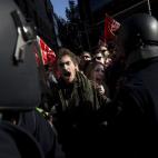 Demonstrators shout against police after they are blocked near Gran Via street during a general strike in Madrid, Spain, Wednesday, Nov. 14, 2012. Spain's General Workers' Union said the nationwide stoppage, the second this year, was being obser...