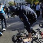 Police clash with protestors during a general strike in Madrid, Spain, Wednesday, Nov. 14, 2012. Spain's main trade unions stage a general strike, coinciding with similar work stoppages in Portugal and Greece, to protest government-imposed auste...