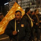 Demonstrators stand outside the Greek Parliament protesting against austerity measures in Athens on November 11, 2012. Thousands of protesters massed outside Greece's parliament Sunday as lawmakers prepared to vote on a 2013 budget that include...