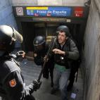 Police arrest a protestor during a general strike, in Madrid, Spain, Wednesday, Nov. 14, 2012. A Spanish Interior Ministry official says 32 people have been arrested and 15 people treated for minor injuries in disturbances as a general strike in...
