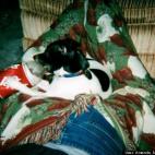 Amanda Michelle Young:He loves to chew on soda bottles and happened to find a comfortable seat on my legs...