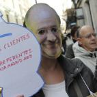 Afectados por preferentes de Bankia increpan a Rato a su llegada a la Audiencia Nacional