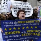 Afectados por preferentes de Bankia increpan a Rato a su llegada a la Audiencia Nacional