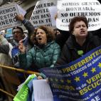 Afectados por preferentes de Bankia increpan a Rato a su llegada a la Audiencia Nacional