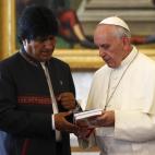 Bolivian President Evo Morales, left, exchanges gifts with Pope Francis, at the Vatican, Friday, Sept. 5, 2013. (AP Photo/Riccardo De Luca, Pool)
