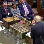 Escuchando a Johnson en los Comunes, en octubre de 2019.