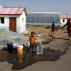 Miembros de esta minoría, en una granja de Hotan