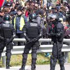 Spanish riot police evacuates Catalan separatists after breaking up a blockade on AP-7 motorway linking Spain to neighbouring France, near Figueras on March 27, 2018. Spanish riot police broke up a blockade by Catalan separatists on major motorw...