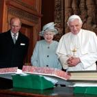 Britain's Prince Philip (L) watches as his wife Queen Elizabeth talks with Pope Benedict XVI during an exchange of gifts in the Morning Drawing Room, at the Palace of Holyroodhouse in Edinburgh, Scotland on September 16, 2010. Pope Benedict XVI...