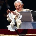 Pope Benedict XVI releases a dove from the window of his appartment at the end of his Sunday Angelus prayer in St. Peter's square at the Vatican on January 27, 2013. The Pontiff and youth of the Catholic Action released two doves, symbol of peac...