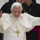 Pope Benedict XVI delivers his blessing as he arrives for the weekly general audience in the Pope Paul II hall at the Vatican, Wednesday, Dec. 28, 2011. (AP Photo/Andrew Medichini)