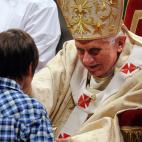 Pope Benedict XVI celebrates Christmas mass at St. Peter's Basilica in Vatican City on December 24, 2011, to mark the nativity of Jesus Christ. Pope Benedict XVI hailed Christ's humility, urging the faithful to look beyond the Christmas 'glitter...