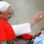 VATICAN CITY, Vatican: Pope Benedict XVI greets pilgrims and faithfull on St-Peter square at the Vatican during his weekly general audience, 14 December 2005. AFP PHOTO / ANDREAS SOLARO (Photo credit should read ANDREAS SOLARO/AFP/Getty Images)