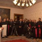 VATICAN CITY - APRIL 20: Pope Benedict XVI (L) greets the Doctrine of the Faith group April 20, 2005 at the Vatican. Cardinal Ratzinger was elected the new Pope on April 19. (Photo by Arturo Mari-Pool/Getty Images)