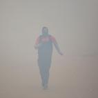 Bangladeshi people make their move in polluted air environment in Dhaka on November 25,2019. Bangladesh, one of the most densely-populated countries in the world, has been struggling with air pollution for a long time, while Dhaka has continued ...