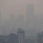 Buildings shrouded in smog, are pictured as Mexico's government ordered schools in and around Mexico City to be closed on Thursday due to elevated levels of pollution, in Mexico City, Mexico May 16, 2019. REUTERS/Henry Romero