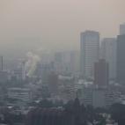 Buildings shrouded in smog, are pictured as Mexico's government ordered schools in and around Mexico City to be closed on Thursday due to elevated levels of pollution, in Mexico City, Mexico May 16, 2019. REUTERS/Henry Romero
