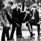 FILE - In this undated file photograph British pop band The Beatles, John Lennon (left) Ringo Starr, Paul McCartney and George Harrison (right) pose for a photograph. Apple Inc. said Tuesday, Nov. 16, 2010, its iTunes service will sell music fro...