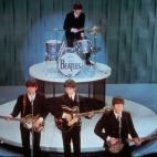 FILE - The Beatles perform at the "Ed Sullivan Show," in New York in this Feb. 9, 1964 file photo. Universal Music Group can buy the famed British music company EMI, including the hugely lucrative Beatles catalogue, the European Union's competit...