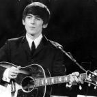 3rd December 1963: Guitarist and singer George Harrison (1943 - 2001) of the popular Merseybeat group The Beatles, performing during a live concert. (Photo by Fox Photos/Getty Images)