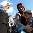 Una familia yazid&iacute; recupera a un ni&ntilde;o, que ha estado en los &uacute;ltimos a&ntilde;os bajo el control del Daesh.