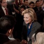 Former US Secretary of State Hillary Clinton greets well-wishers after receiving the 2013 Lantos Human Rights Prize during a ceremony on Capitol Hill in Washington on December 6, 2013. (Photo credit should read NICHOLAS KAMM/AFP/Getty Images)
