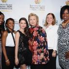NEW YORK, NY - DECEMBER 03: (L-R) EGPAF Ambassadors Fortunata Kasege, Florida Mwesiga, EGPAF Celebrity Ambassador Fatima Ptacek, Global Impact Award Recipient Hillary Rodham Clinton, Ginny Courtney, EGPAF Ambassador Florence Ngobeni-Allen atte...