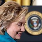 WASHINGTON, DC - NOVEMBER 20: Former U.S. Secretary of State Hillary Clinton greets guests before U.S. President Barack Obama awarded former U.S. President Bill Clinton the Presidential Medal of Freedom in the East Room at the White House on No...