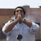 Venezuela's interim President Nicolas Maduro greets supporters as he arrives to cast his ballot in the presidential election in Caracas, Venezuela, Sunday, April 14, 2013. Maduro, who served as the late President Hugo Chavez's foreign minister a...