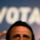 Opposition presidential candidate Henrique Capriles speaks during a news conference in Caracas, Venezuela, Saturday, April 13, 2013. Capriles is running against ruling party candidate and acting President Nicolas Maduro in Sunday's special presi...