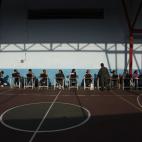 Election workers wait for voters at a polling station during the presidential election in Caracas, Venezuela, early Sunday, April 14, 2013. Interim President Nicolas Maduro, who served as the late Hugo Chavez's foreign minister and vice presiden...