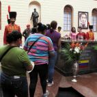 People visit the tomb of Venezuelas late President Hugo Chavez at the Military Museum in Caracas, Venezuela, Saturday, April 13, 2013. Just over a month after Chavez succumbed to cancer, Venezuelans will line up to vote Sunday for a new leader...