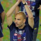 Barcelona's coach Josep Guardiola celebrates with supporters during a celebration at the Camp Nou stadium in Barcelona on May 26, 2012 a day after the team won the Spanish King's cup final football match against Athletic Bilbao. AFP PHOTO/ JOSEP...