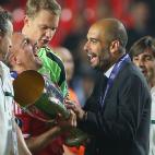 PRAGUE, CZECH REPUBLIC - AUGUST 30: Franck Ribery of Bayern Muenchen celebrates with his head coach Pep Guardiola after winning the UEFA Super Cup between FC Bayern Muenchen and Chelsea FC at Stadion Eden on August 30, 2013 in Prague, Czech Rep...